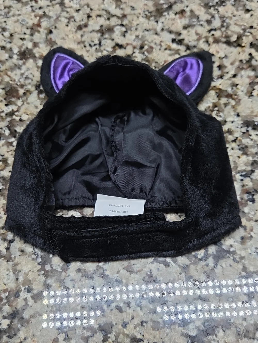 Black and purple pet bat costume features shiny metallic wing fabric